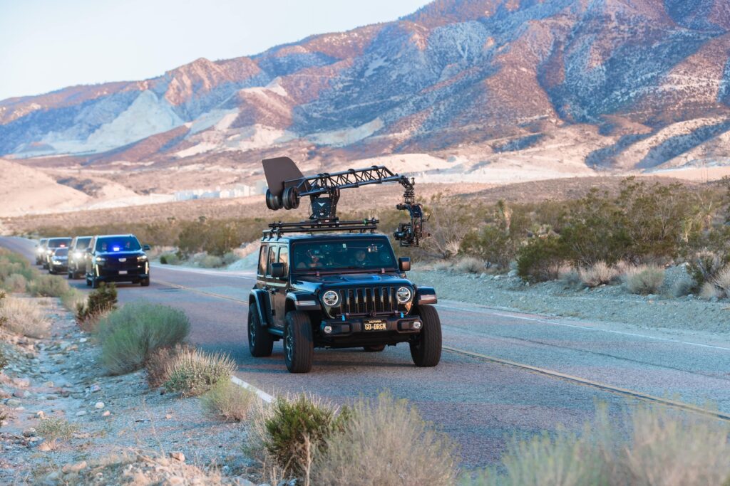 car camera crane russian arm on a road filming security cars